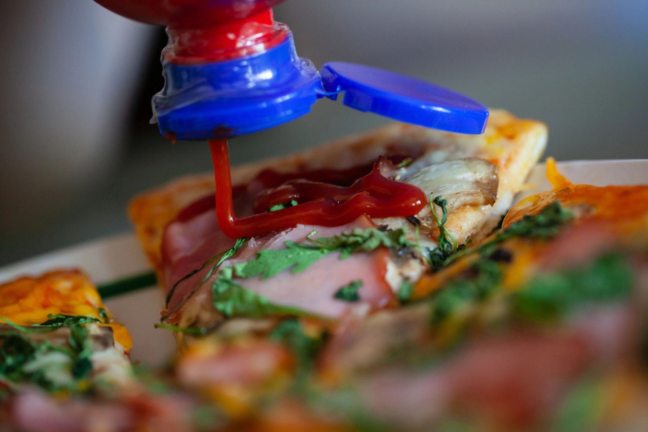 Freshly baked homemade pizza on a table in an Italian kitchen setting